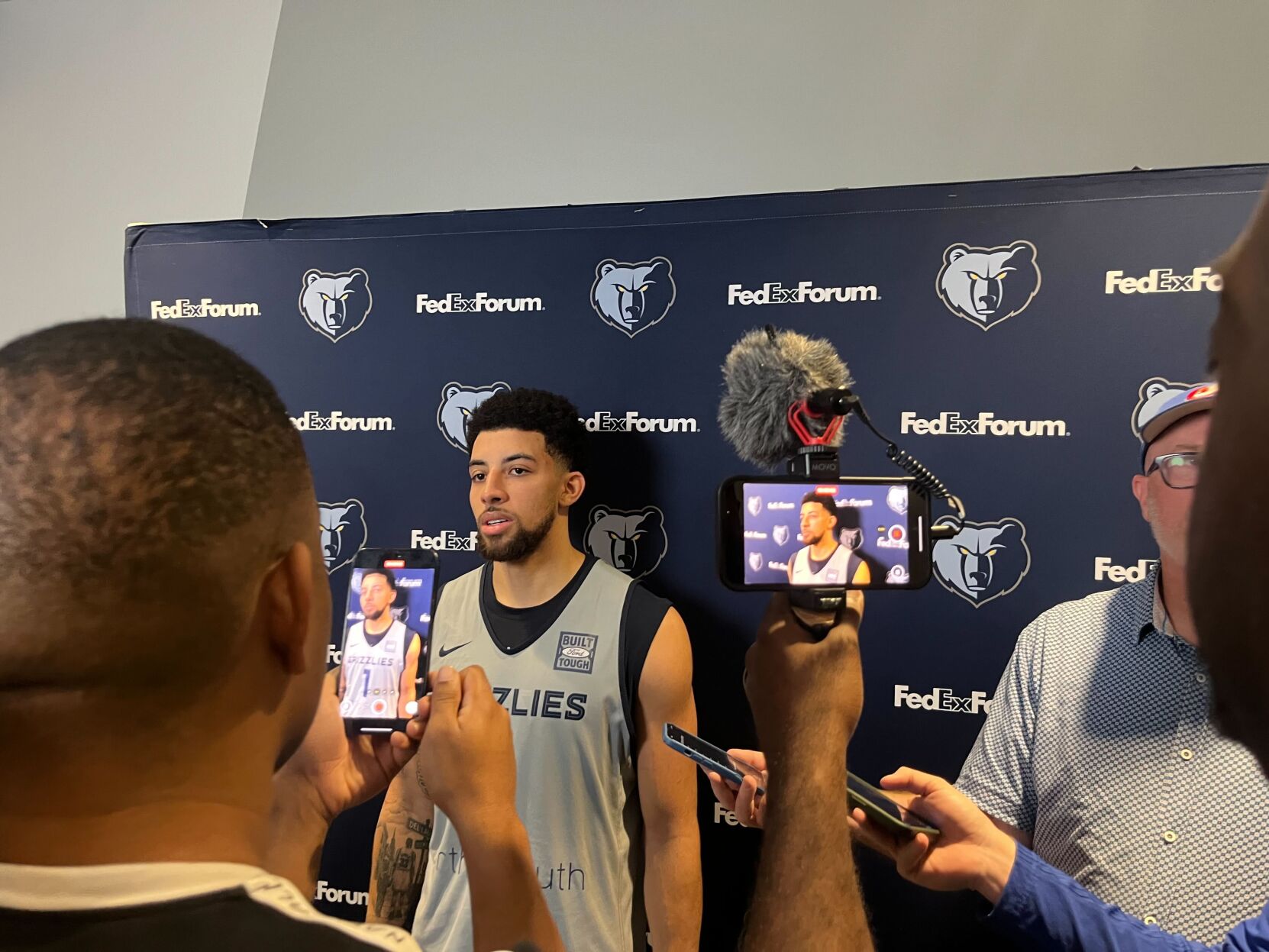 Scotty Pippen Jr. speaks to press and cameras capture his image